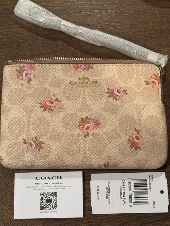Coach Handbags - Coach Pink Floral Signature Zip Wristlet Pouch